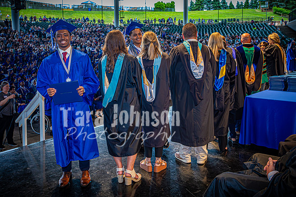 2024 IA Graduation - Diploma with audience behind - TJP (174 of 178)