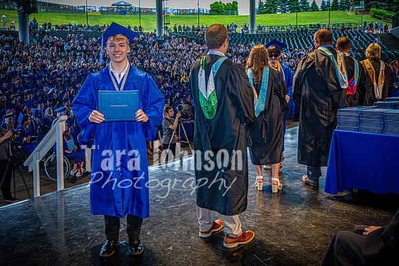 2024 IA Graduation - Diploma with audience behind - TJP (141 of 178)