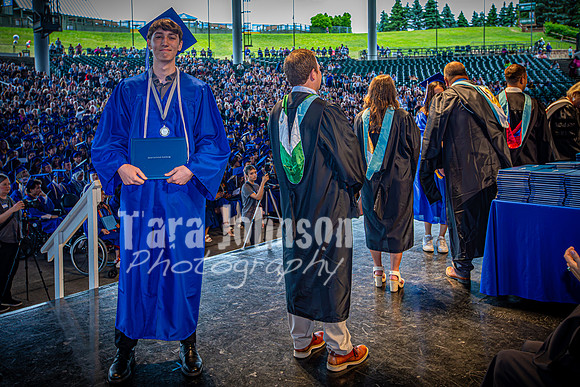 2024 IA Graduation - Diploma with audience behind - TJP (154 of 178)