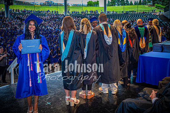 2024 IA Graduation - Diploma with audience behind - TJP (173 of 178)