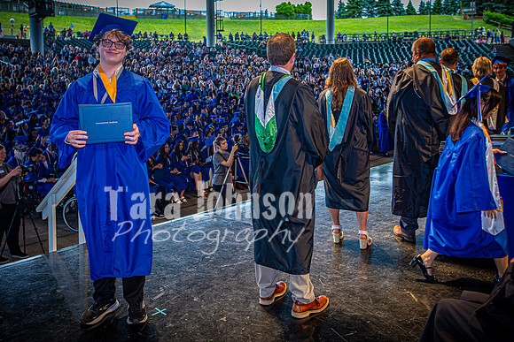 2024 IA Graduation - Diploma with audience behind - TJP (146 of 178)