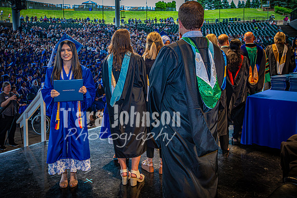 2024 IA Graduation - Diploma with audience behind - TJP (176 of 178)